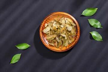 Dried coca leaves in the bowl - Erythroxylum coca