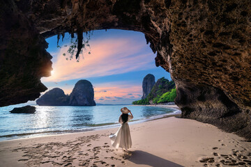 Woman walking on Railay beach, Krabi in Thailand. - obrazy, fototapety, plakaty