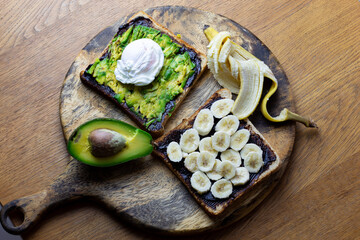 Avocado and poached egg on toast with Vegemite and banana with vegemite on Toast