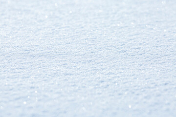 White shimmering surface of snow as background