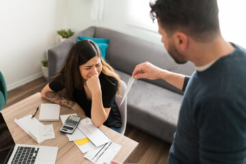 Husband complaining to his wife about her debt
