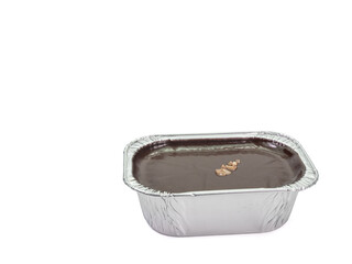 Chocolate fudge cake, a close up of homemade mousse brownie cake in aluminum foil cup isolated on...
