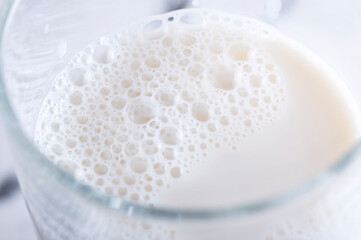Delicious, nutritious milk is poured into a glass.