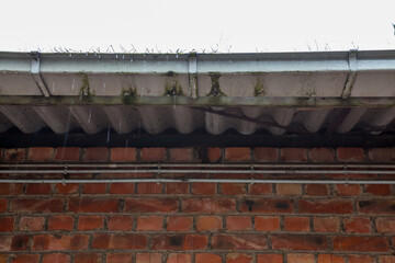 a full leaking gutter