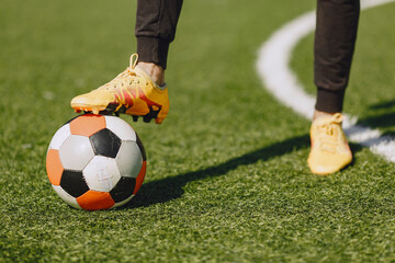 Obraz premium Sporman is playing football and practising with the ball