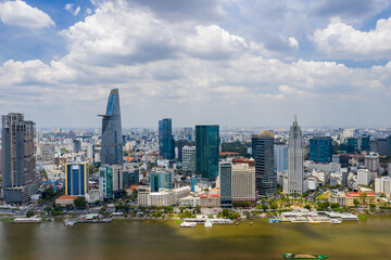 Fototapeta premium Aerial cityscape of Ho Chi Minh city along Saigon river
