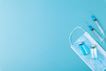 Fototapeta na wymiar Glass vaccine ampoules, bottles, syringes, needles, pills