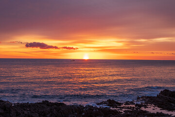 夏の雄武町日の出岬 日の出と漁船の風景
