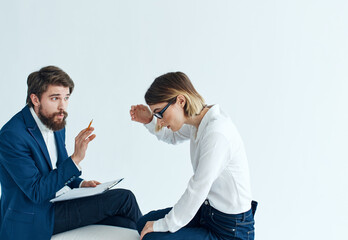 Business men and women sit on the couch communicating employees psychology 