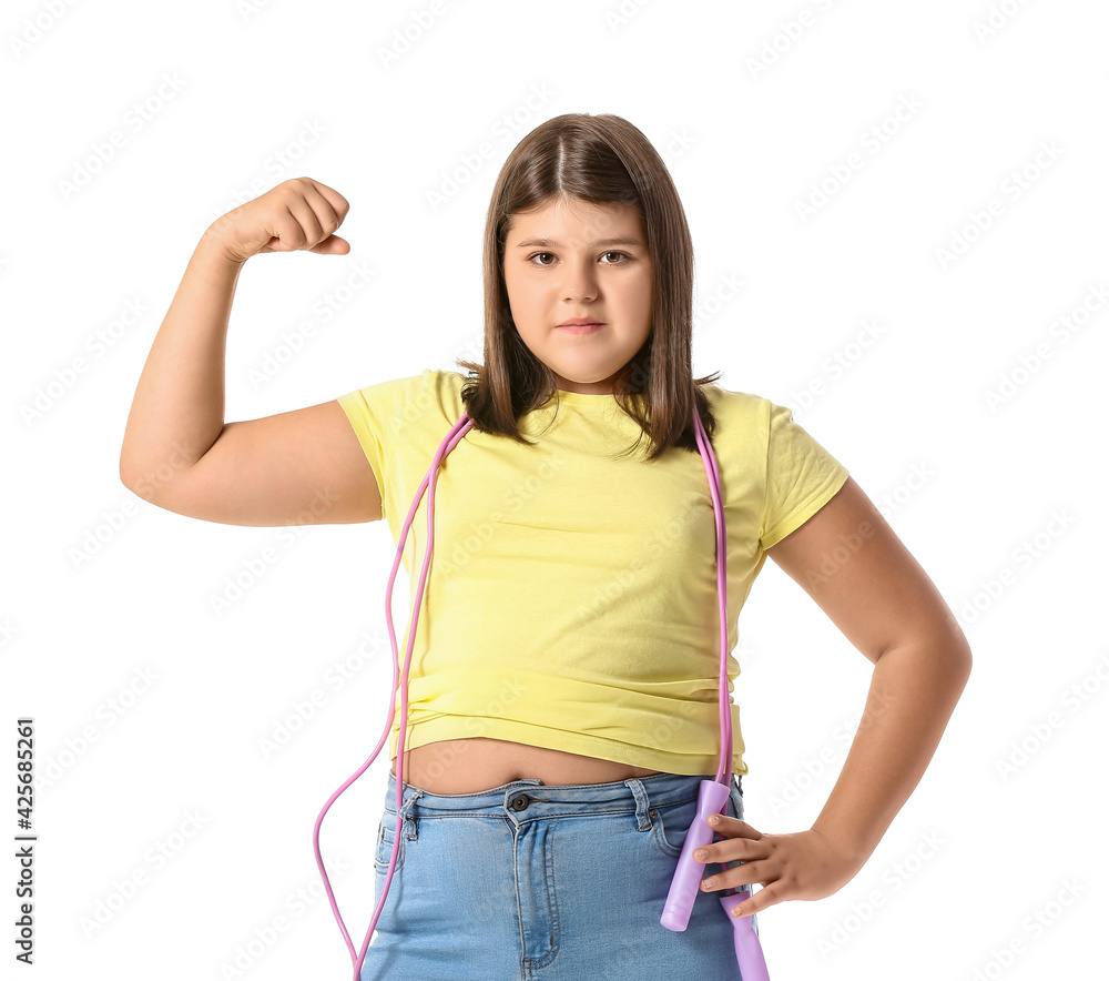 Wall mural overweight girl with jumping rope on white background