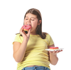Overweight girl eating unhealthy doughnuts on white background