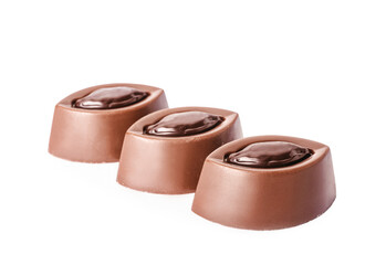 Tasty chocolate candies on white background