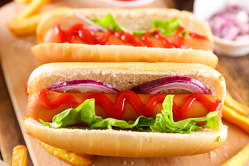 hot dog with lettuce,  sausage and ketchup