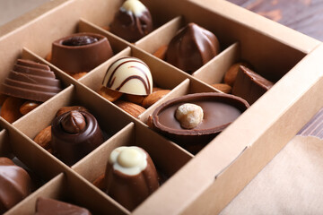 Box with tasty chocolate candies, closeup