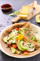 buckwheat crepe with egg,  avocado and cheese