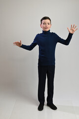 Caucasian guy teenager in full growth on white background