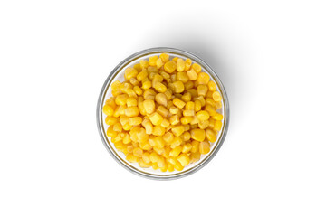 Sweet canned corn in glass bowl isolated on white background.