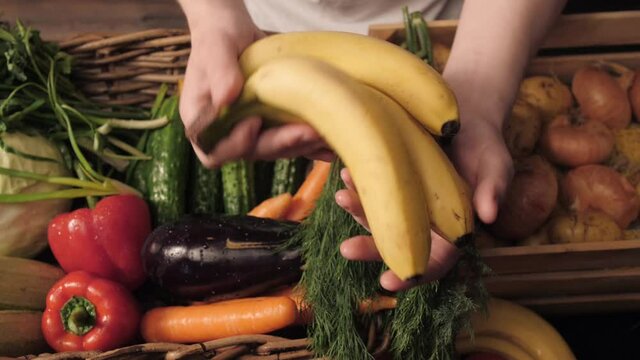 Assortment of fresh vegetables and fruits on wooden table