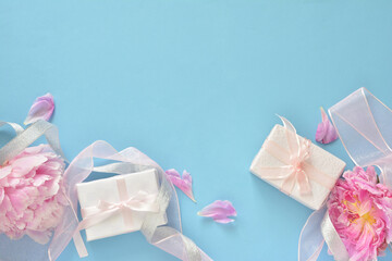 Gift box with pink peony flowers