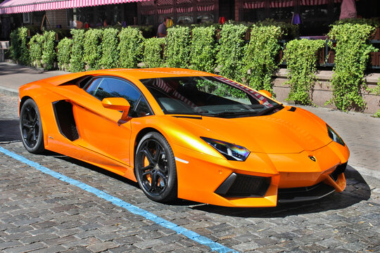 Kiev, Ukraine - June 17, 2012: Lamborghini Aventador is parked in the city. Bright orange supercar in the city center