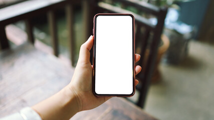Women's hands holding cell telephone blank copy space screen. smart phone with technology concept
