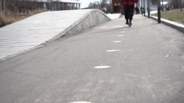 teeneger  rides a scooter