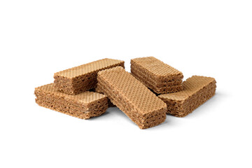 Heap of dark wafer biscuits isolated on white background