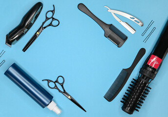 Tools for cutting hair on a blue background.Top view.