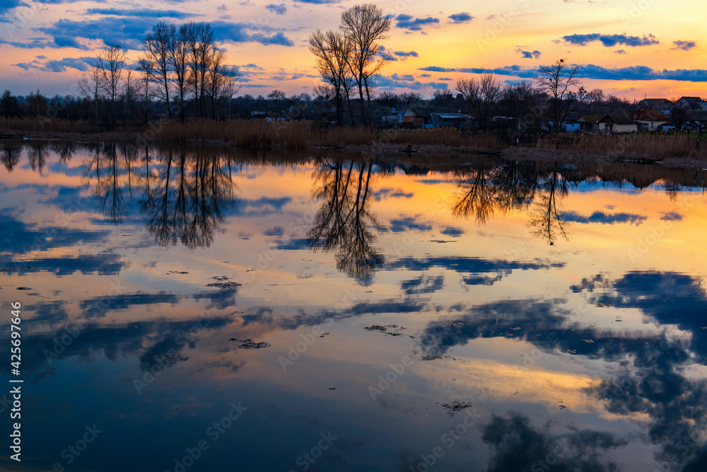 Wall mural calm evening on the lake.