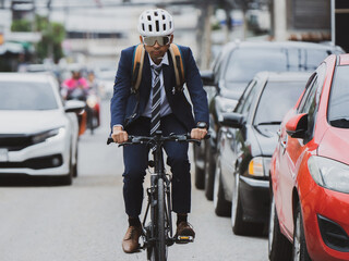 Salary workers are cycling in the city to work at rush hour.