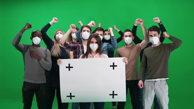 Protest movement, woman activist holding a protest poster, a protesting crowd in the background, people shouting and sconding, template on a chromakey.
