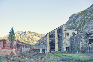 Abandoned mining factory, destroyed by time and hooligans, located in the mountains.