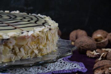 Beautiful esterhazy cake on a dark background, side view, copy space.