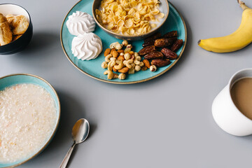 Bright breakfast, tasty oatmeal, cup of coffee