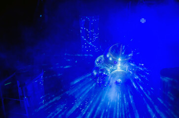 Disco ball with bright rays and smoke