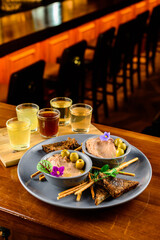tasting set, assorted alcoholic tinctures and snacks. still-life
