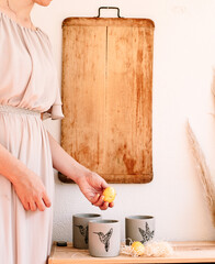 Nordic living with a brown cutting board and pampas grass and yellow egg 