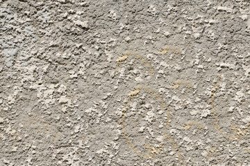The wall is aged by time with uneven depressions and roughness