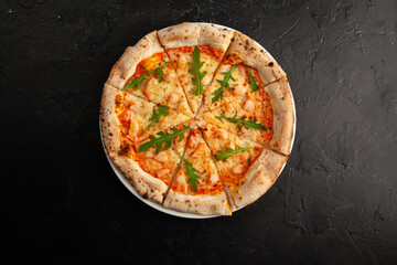 fresh italian pizza on black background