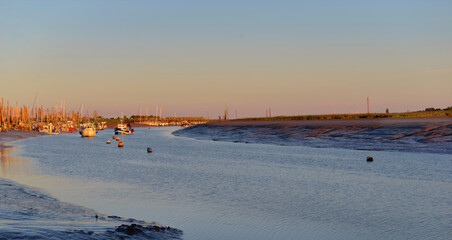 beautiful sunset on the fairway  with little fishing boats background at low tide