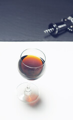 Alcoholic drink in a glass on a light