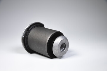 New auto parts. Suspension bushing on a gradient gray background