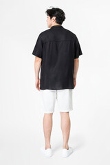 Man in black shirt and shorts with design space casual wear fashion rear view
