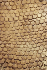 The texture of imitation chain mail of a golden hue