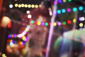 The luminous rays from the lanterns are multicolored, from the bokeh effect of the photo lens