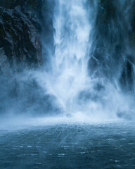 Fototapeta na wymiar Base of Stirling Falls in Milford Sound, New Zealand. Vertical format.