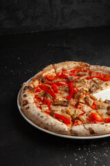 fresh italian pizza on black background