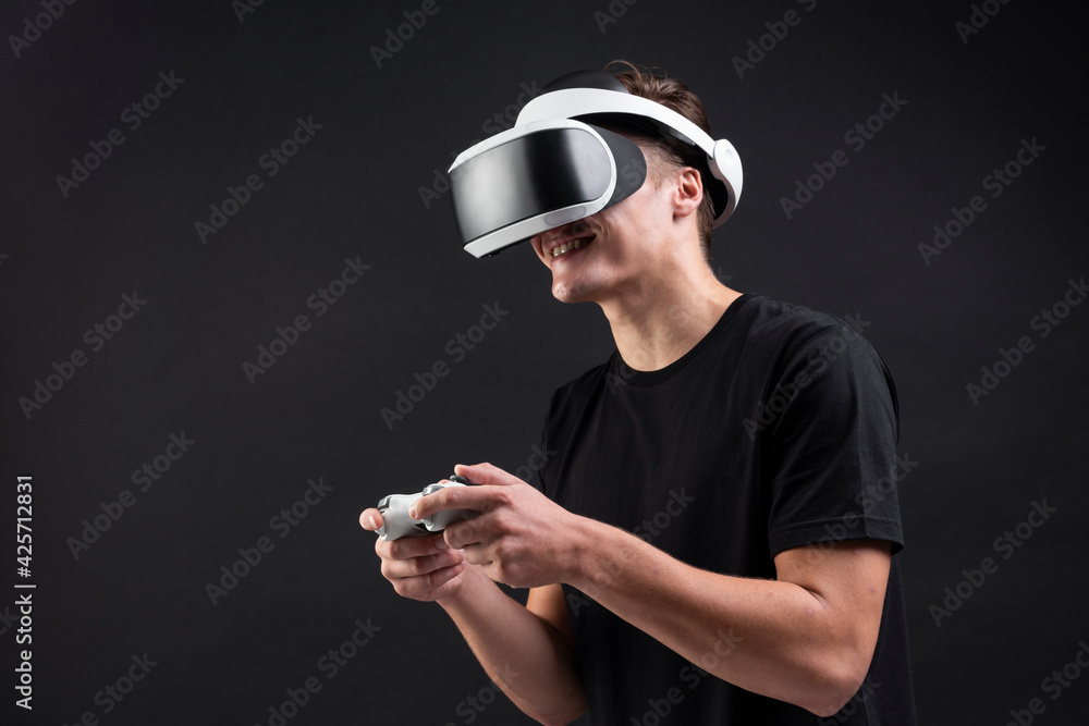 Aufkleber man in vr headset playing game with a wireless controller entertainment technology