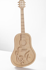 Naklejka premium Guitar made of wood and plywood on a white background