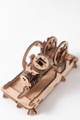 A wooden engine on a white background close-up